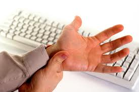 Carpel Tunnel Syndrome pain relief using keyboard offered by Chiropractors of San Diego Chiropractic Massage